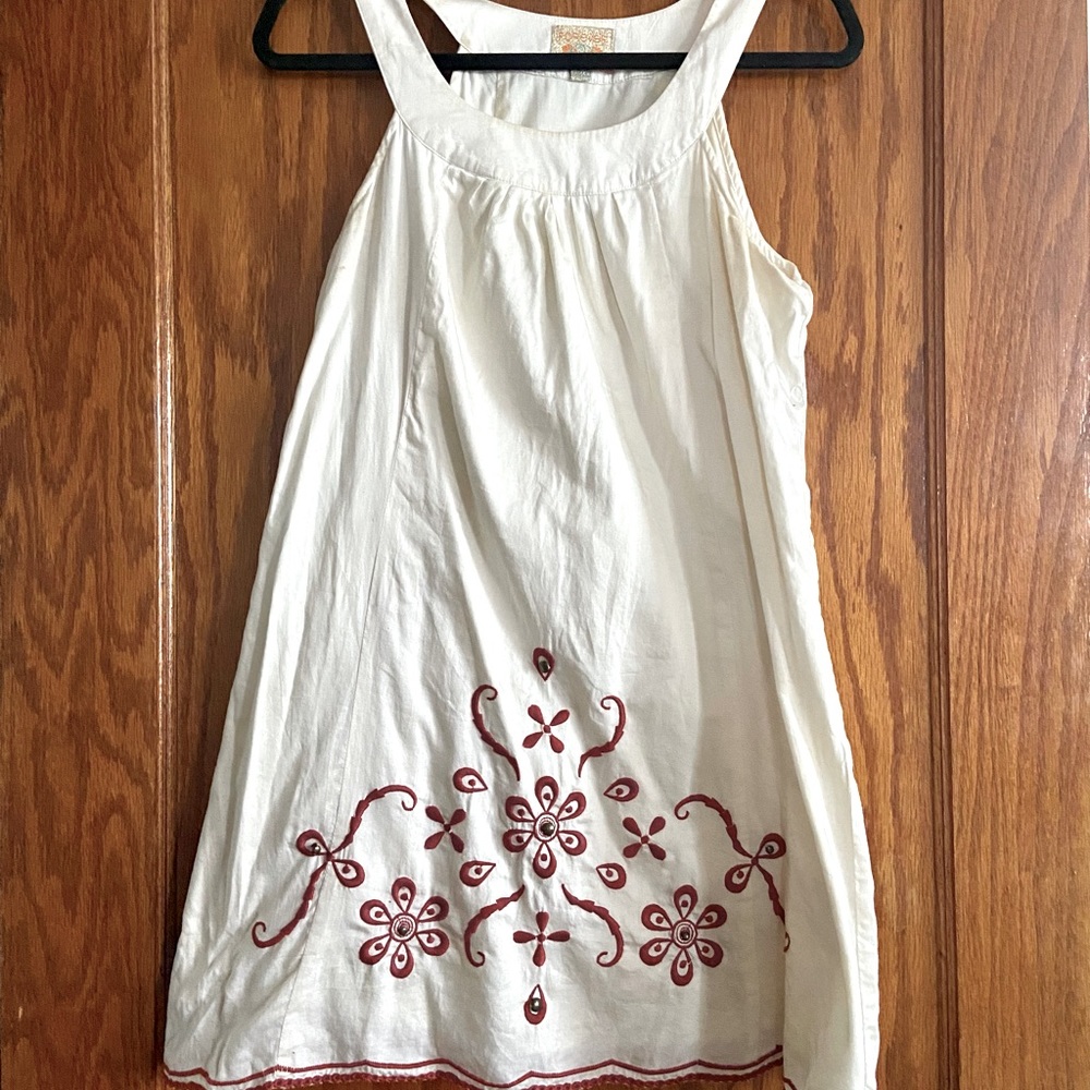Off white trapeze dress with red embroidery